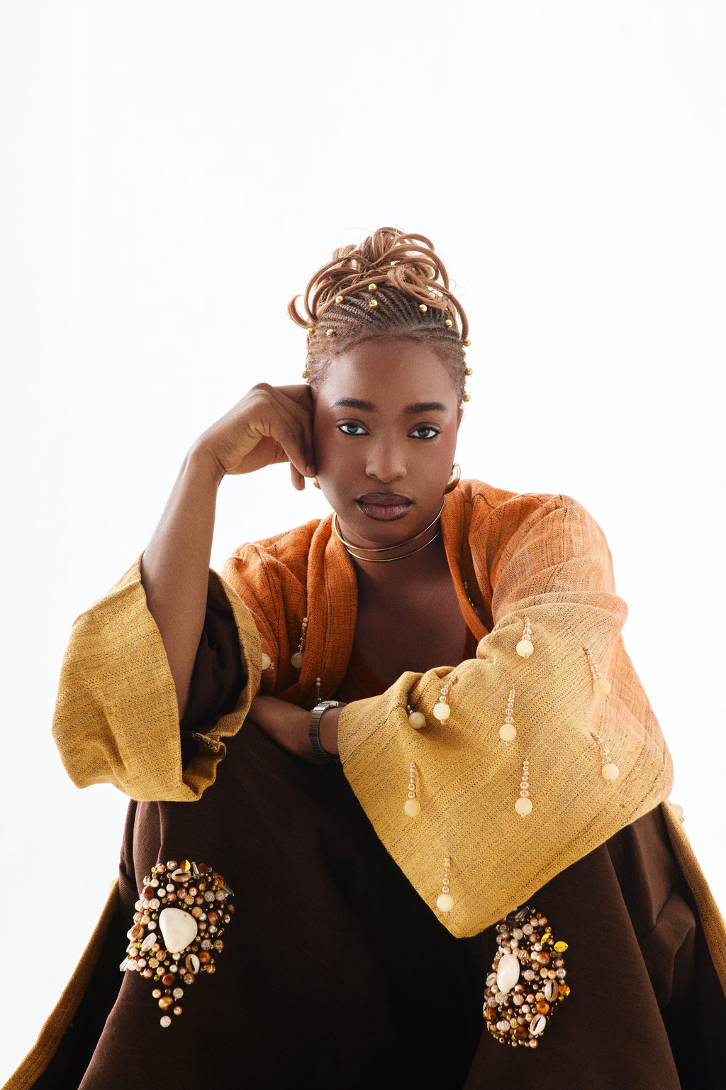 Editorial styling 1 of the ÌGBÀANÌ Aureline Kimono, Shellwork Trousers and Ember Clay Tank
