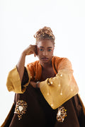Editorial styling 1 of the ÌGBÀANÌ Aureline Kimono, Shellwork Trousers and Ember Clay Tank