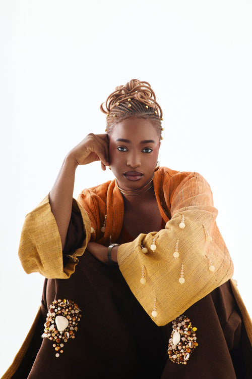 Editorial styling 1 of the ÌGBÀANÌ Aureline Kimono, Shellwork Trousers and Ember Clay Tank