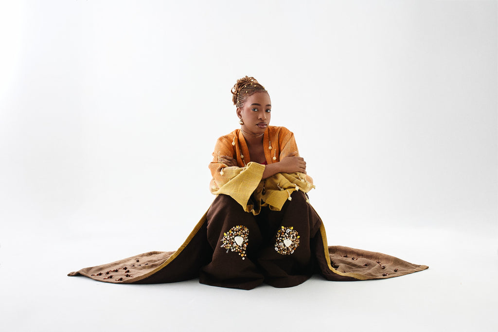 Editorial styling 2 of the ÌGBÀANÌ Aureline Kimono, Shellwork Trousers and Ember Clay Tank