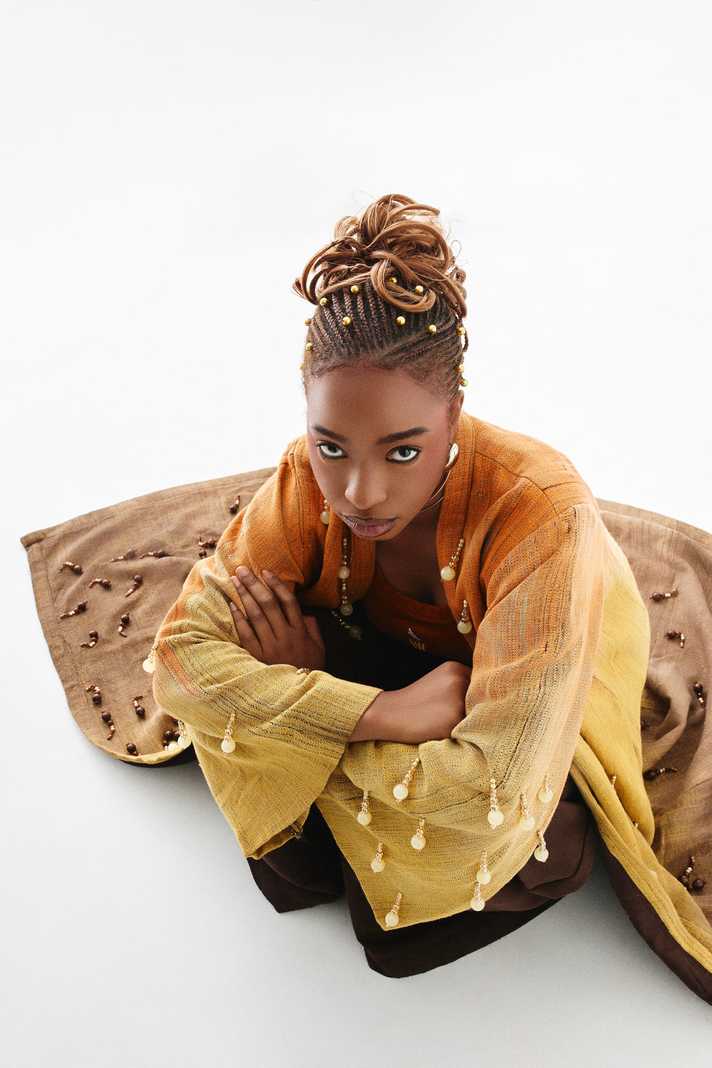 Editorial styling 3 of the ÌGBÀANÌ Aureline Kimono, Shellwork Trousers and Ember Clay Tank